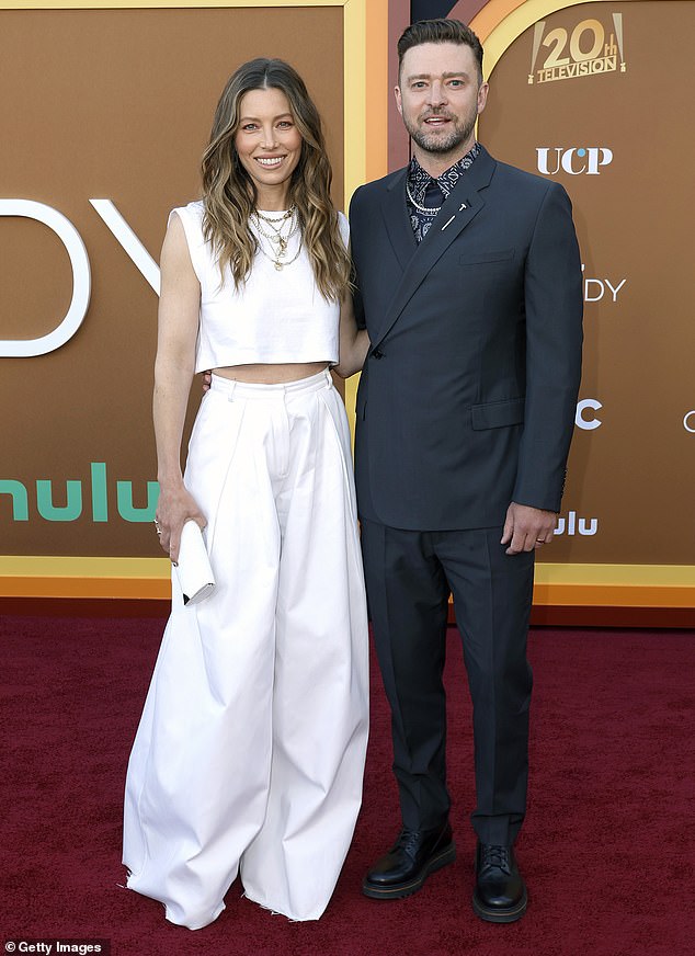 Jessica Biel is a vision in a white crop top while Justin Timberlake rocks a suit at Candy premiere