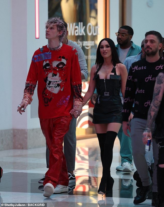Megan Fox puts on a busty display in sexy LBD as she holds hands with fiance Machine Gun Kelly
