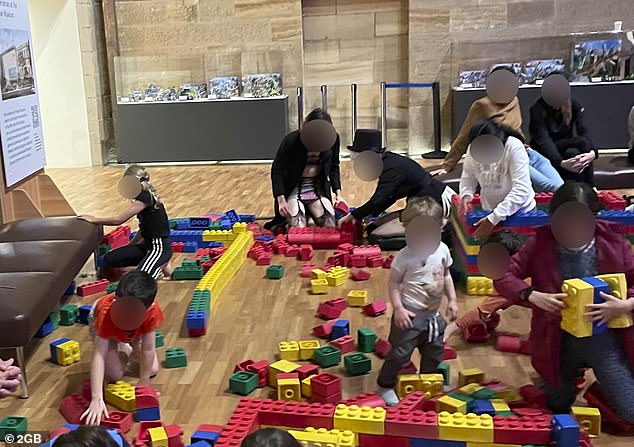 Australian Museum Sydney photo of man in lingerie playing Lego with kids