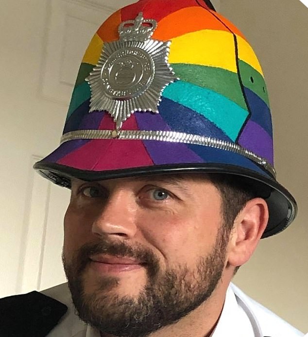Is this Britain’s wokest cop? Cambridge superintendent pictured wearing rainbow helmet on patrol