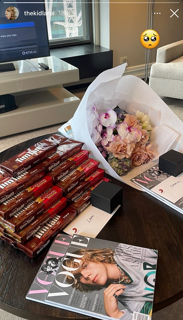 The Kid Laroi shows off his Tim Tam stash as he jets back home to Australia with his girlfriend