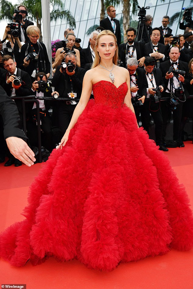 Kimberley Garner looks glamorous in sweeping princess gown with abundant ruffle detail in Cannes