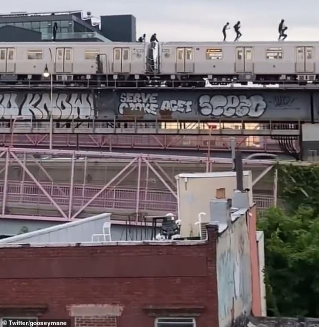 A group of at least EIGHT people subway surf cars across NYC on the Williamsburg Bridge