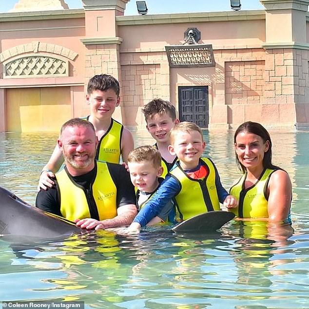 Coleen and Wayne Rooney slammed by animal rights activists after family swam with dolphins in Dubai