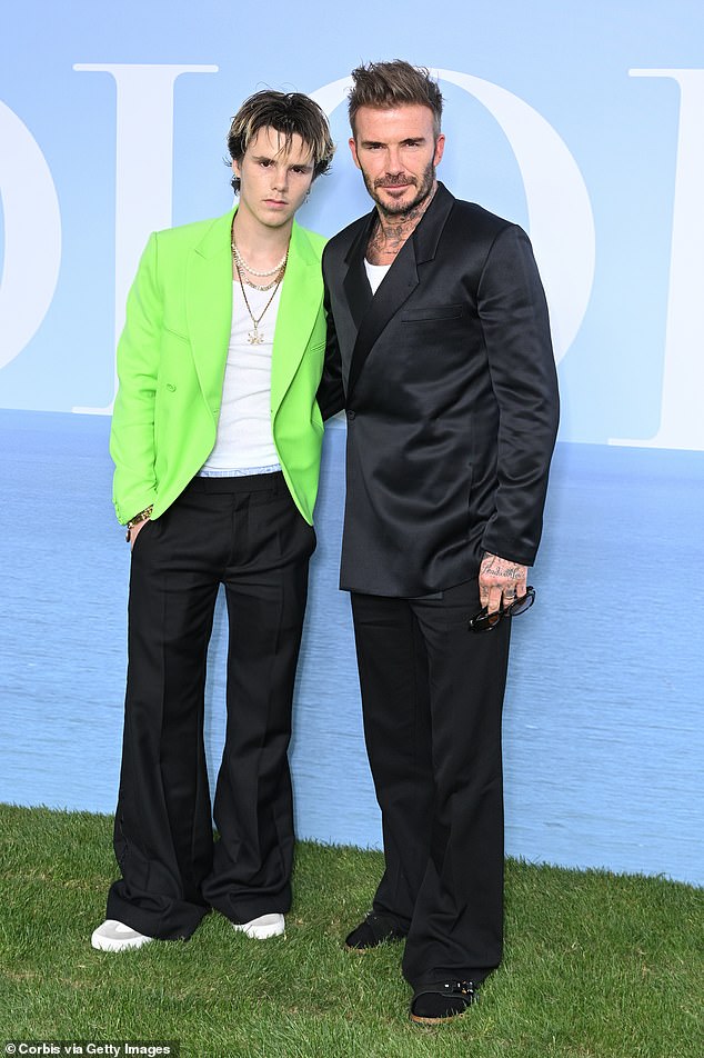 Cruz Beckham sports cannabis necklace as he joins his dad David at Dior PFW show