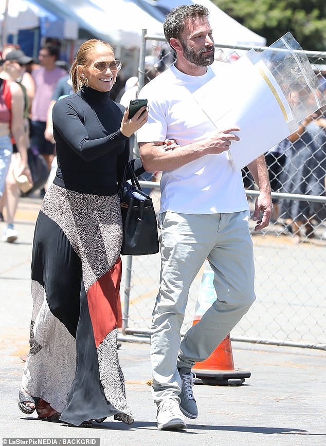 Jennifer Lopez and Ben Affleck walk arm-in-arm at Melrose Trading Post over 4th of July Weekend